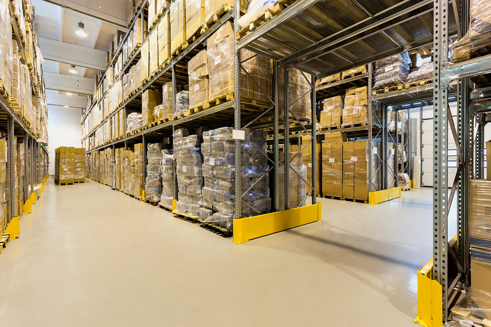 Interior of a huge spacious warehouse with carton boxes Interior of a huge spacious warehouse with carton boxes